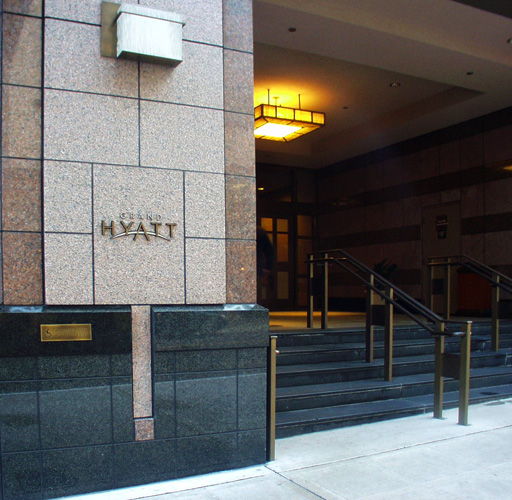 Granite column logos. The lettering was jet cut, finished and stud mounted into sandblasted recesses in granite.
